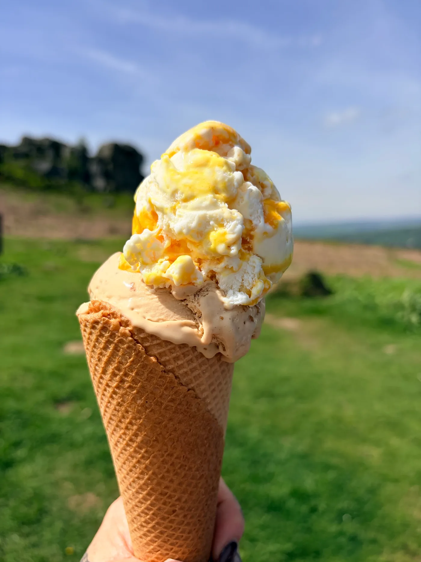An ice cream cone enjoyed outside the cafe, with the rocks in the background